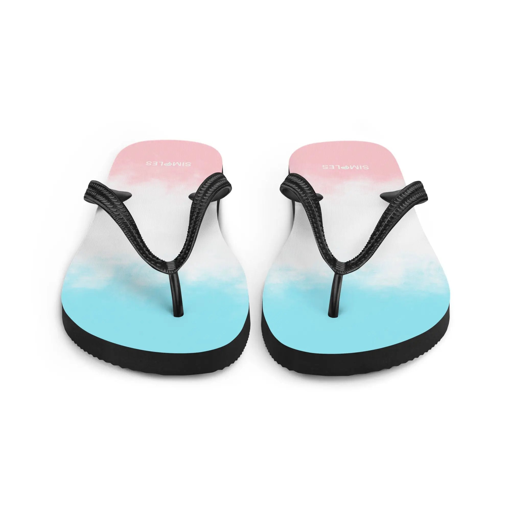 Pair of Simples Market flip-flops with pink-to-blue gradient soles and black braided straps