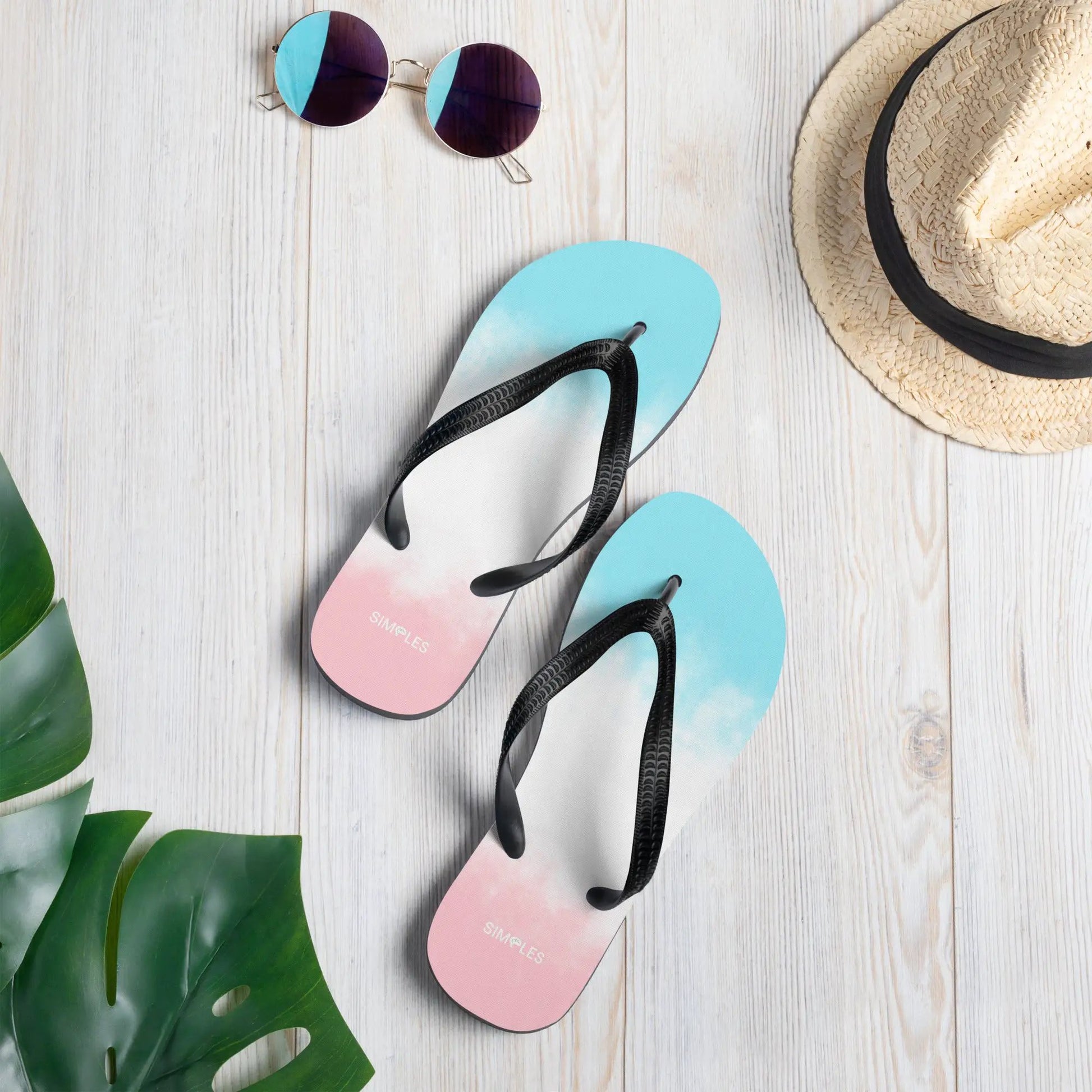 Flip-flops by Simples Market; pastel gradient soles on light wood background