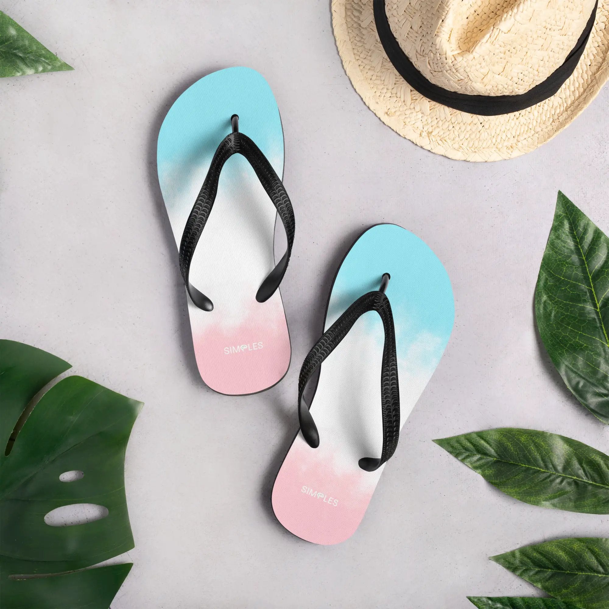 Flip-flops by Simples Market in pastel pink and blue gradients with black straps, multiple pairs shown