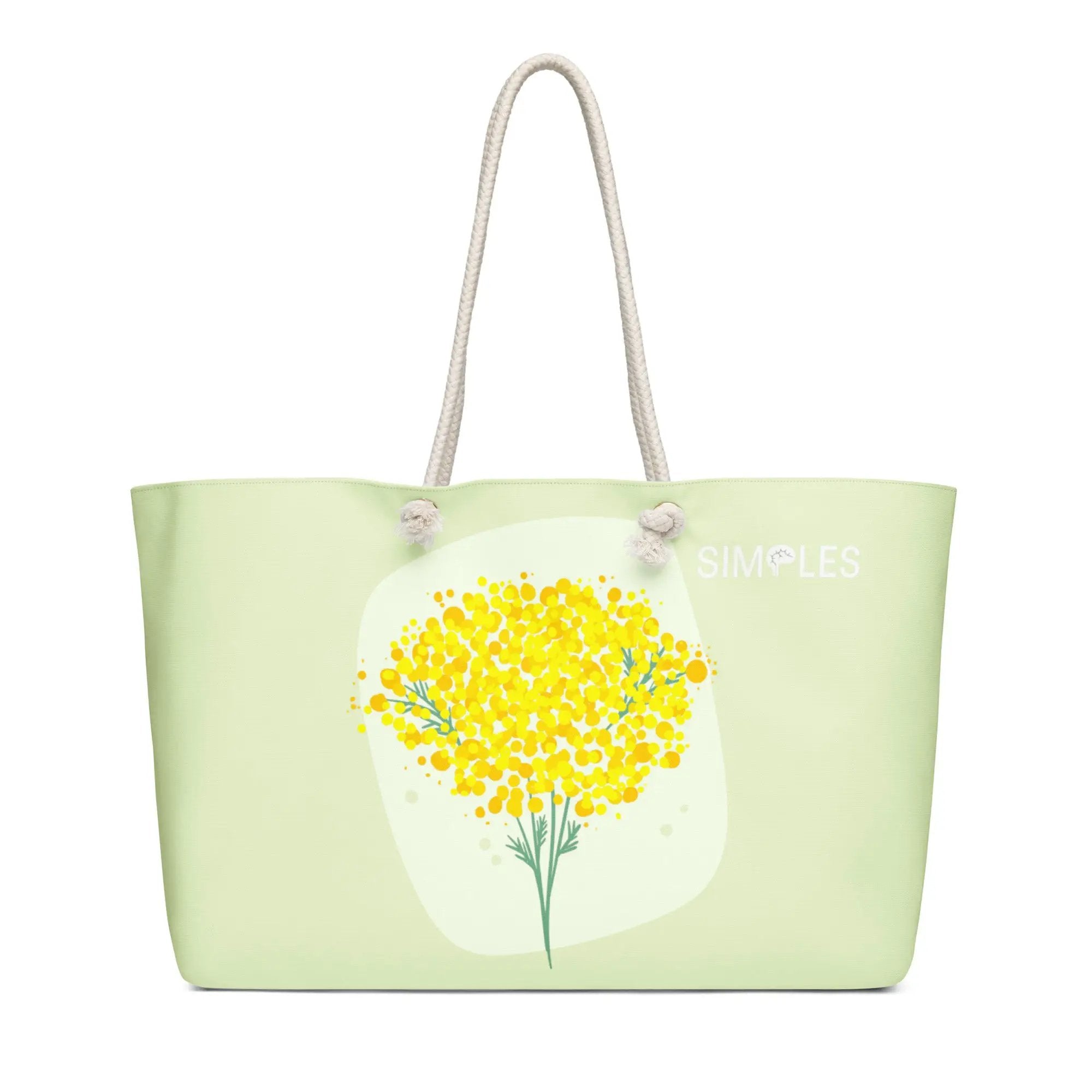 Oversized weekender bag by Simples Market; pale green canvas with rope handles.