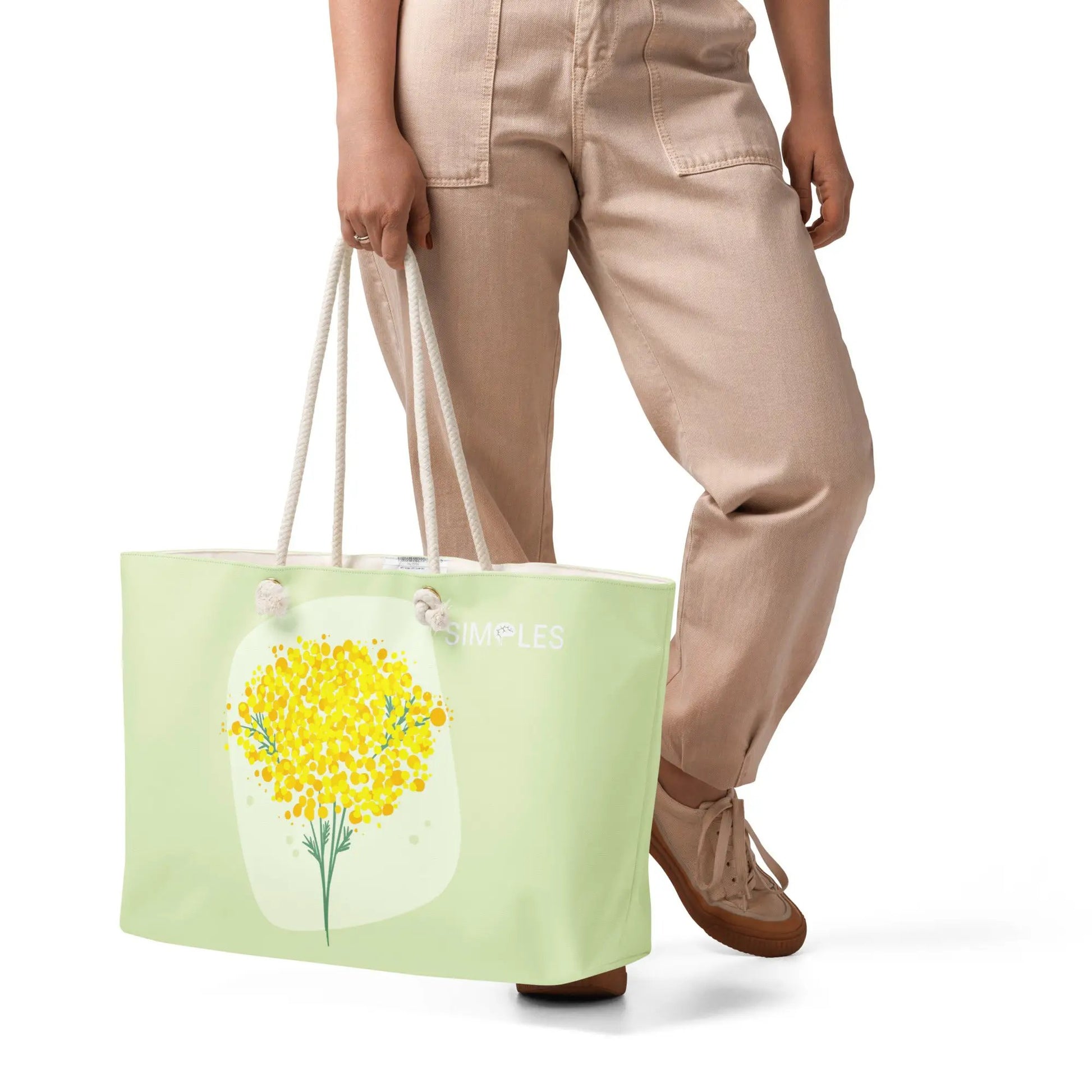 Oversized weekender bag Simples Market; mint green tote with rope handles and floral print.