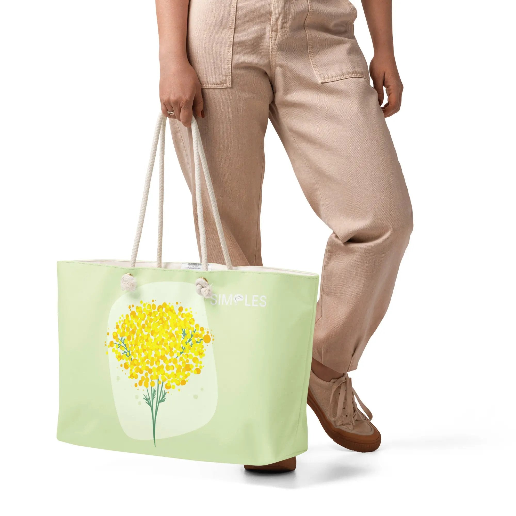 Oversized weekender bag Simples Market; mint green tote with rope handles and floral print.