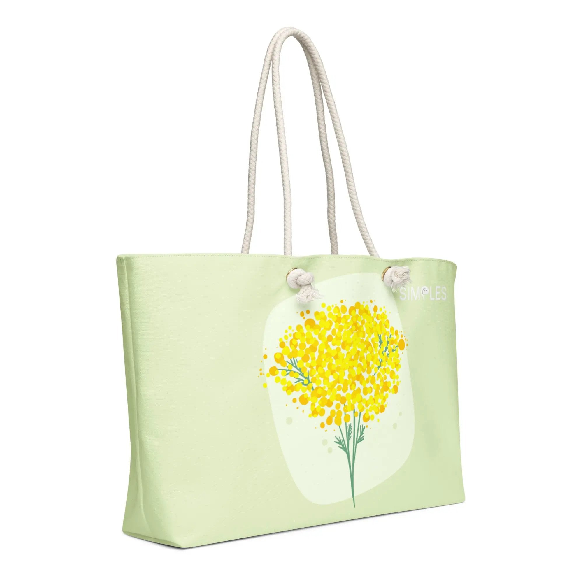 Oversized weekender bag by Simples Market in light green with rope handles and yellow floral print