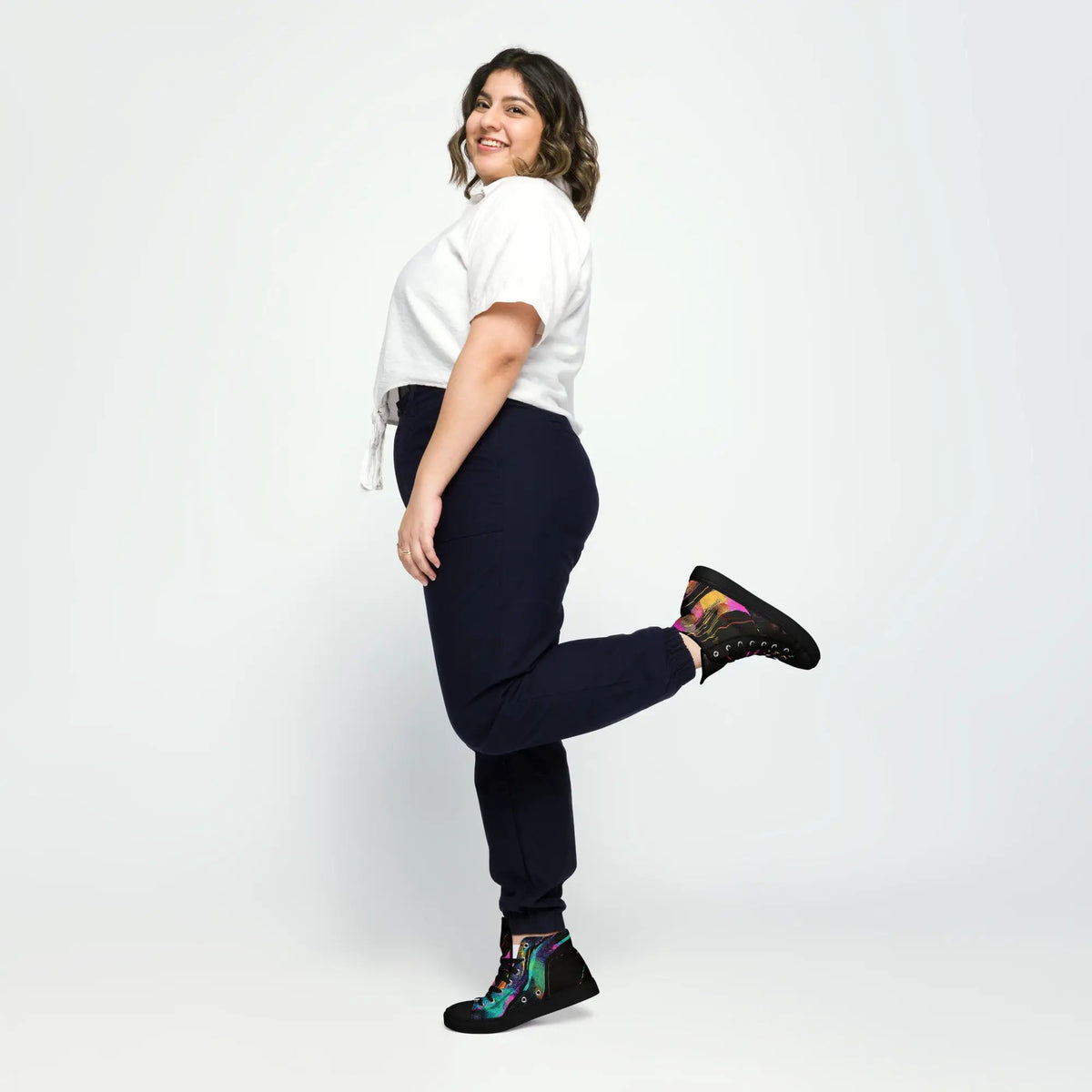 Women’s high-top canvas shoes by Simples Market with a colorful printed upper and black sole