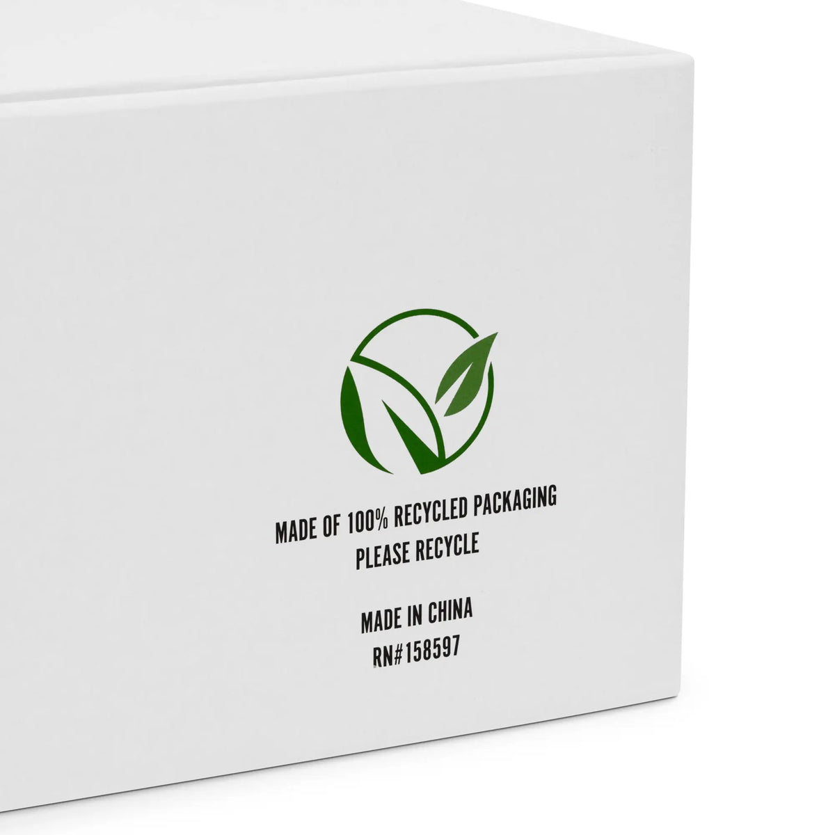 Box packaging for women’s high-top canvas shoes; white box with green recycling logo and 100% recycled packaging.